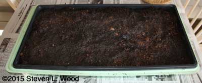 Slotted flat in perma-nest tray