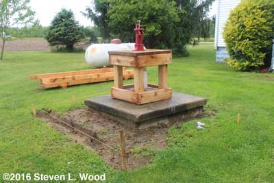 Raised bed project around shallow well