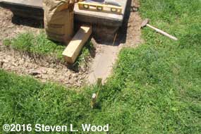 Using sand to help level trenches