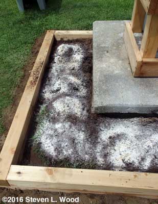 Lime, peat moss, and gypsum spread over clay soil