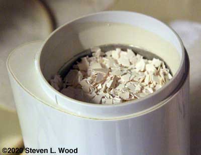Crushed egg shells in coffee grinder