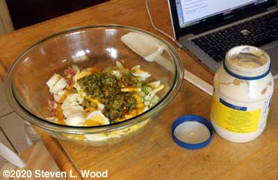 Adding ingredients to mixing bowl
