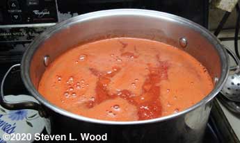 Tomato juice boiling down to purée