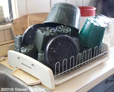 Pots drying in dish drainer