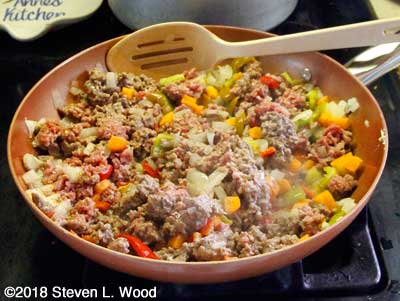 Ground beef added to pan to brown