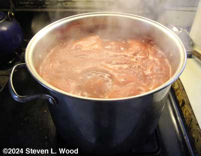 Tomatoes boiling down into puree