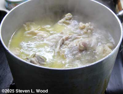 Chicken carcasses boiling down
